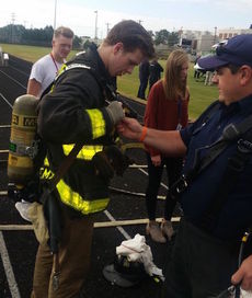 Students donned firefighters turn-out gear.
 