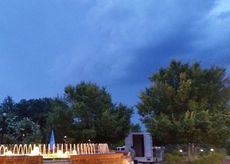 Dark clouds preceded the lightning, thunder and rain that scattered the spectators and ended the night's entertainment.'