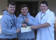 Greer High School Service Learning students donated $469.04 to Greer Community Ministries as part of a fundraising project. From left, Gavin Coker, Jacob Schaffner and Bryson Payne, seniors in the Service Learning class and volunteers at GCM three times per week, delivered the funds. 
 
 