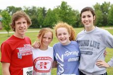 Cameron Fowler and Mikie Harris were the overall male and female winners, respectively, at the Riverside Middle School iMove 5K Fun Run/Walk. Left to right: Fowler, Harris, Erin Woods and Erin Rose-Innes.