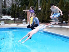 Some of the daring participants in the polar plunge ignored the remaining ice in the background. 
 