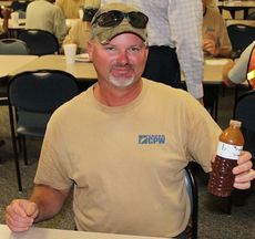 Jeremy Gossett brought his homemade barbecue sauce in a water bottle. He shared the sauce with his department but did not share the recipe.
 