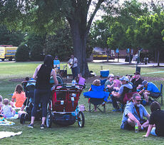 Secondhand News performs under City Park's oak tree while families enjoy offerings from Food Trucks.
 