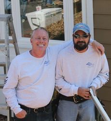Chip Wilson and Ricky Page, right, of Taylors Windows and Screen were among the crew helping install new windows at the Ronald McDonald House in Greenville.