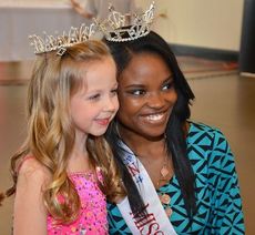 On the cover: Little Miss Ellie Mason is all smiles posing with Miss Greater Greer Teen Brittany Doss.