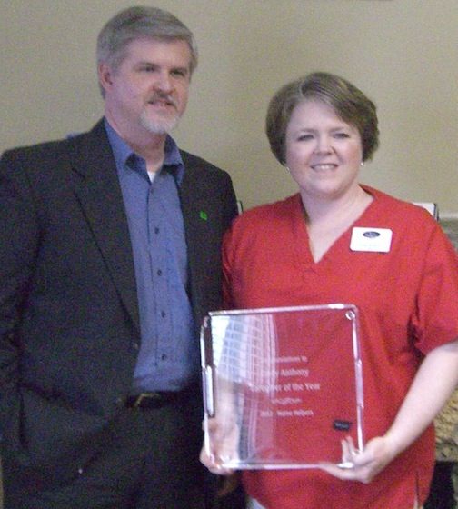 Cindy Anthony, and her husband, Mark, pose for a picture during the ceremony honoring the caregiver for outstanding service in 2012.