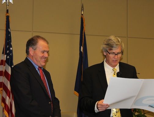 Mayor Rick Danner reads a proclamation commending Greer Commission of Public Works General Manager Nick Stegall.