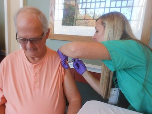 Bobby Chapman gets his free flu vaccine from nurse Mandy Thompson at Greer Memorial Hospital. A second session is being offered today from 3-6 p.m. 