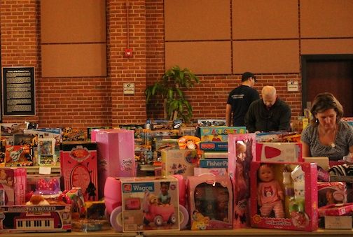 Toys for boys and girls were placed on and underneath tables, sports balls and equipment were stacked neatly against walls and the city arts center took on the appearance of toyland Friday.