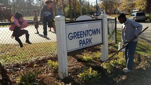 Greentown Park was the beneficiary of two picnic tables and a facelift. Neighborhood children watched their park take on a new personality.
