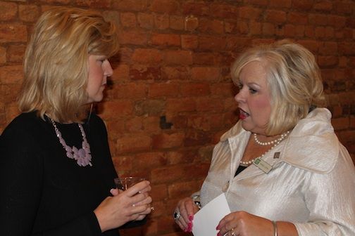 Furman University President Elizabeth Davis, left, chats with Karen Corn of Greer State Bank at Tuesday's Women's Forum on Work and Life Balance.
 