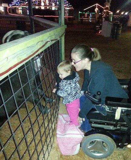 Kim Wooten and her daughter, Madelyn, at the petting zoo.
 