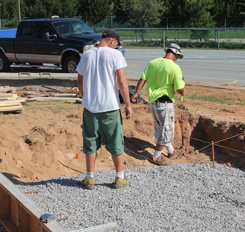 The triple jump pit is being formed at the Greer High School track.
 