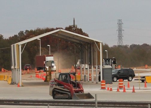 A truck enters the inland port Tuesday from Dobson Road. Trucks will now enter the port on GSP Logistics Parkway and onto International Commerce Way.