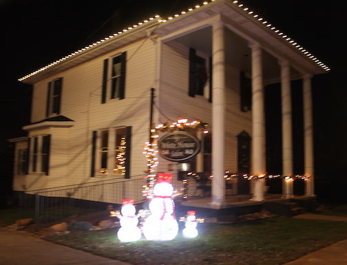 The White House Salon is decorated for Christmas as it sits at a gateway into downtown Greer at 200 School Street.
 