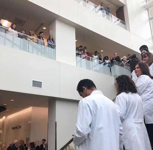 Doctors, families and friends line the stairs to the second floor with others watching the ribbon cutting ceremonies from the balconies of the Gibbs Cancer Center and Research Institute in Greer.
 