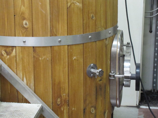 Wood covered tanks pictured are 3.5 bbl stainless steel fermentation tanks from the brewing system that Tom and Bill purchased to be used at Henneys