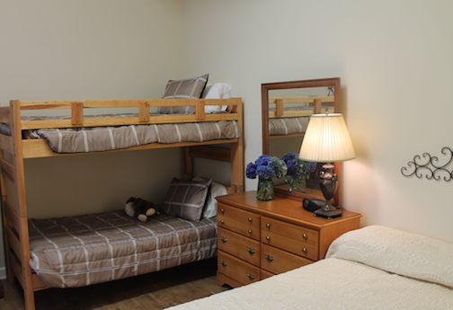 The bedroom also has a bunk bed where two children can sleep.
 