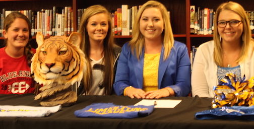 Friends join Hayley Smith during the signing celebration.
 