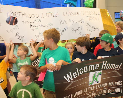 Banners, signs, shirts, balloons and scores of family and friends greeted the Northwood Little players on their return from Williamsport, Pa.
 