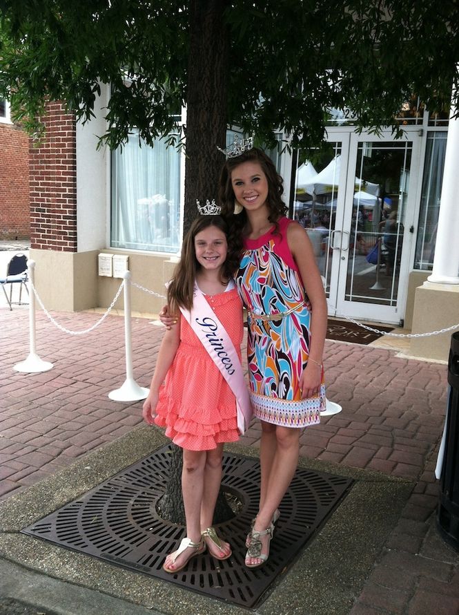 Kirby Mathis, Sill's Palmetto Princess, take time for a photograph in downtown Greer on Trade Street in front of The Davenport.