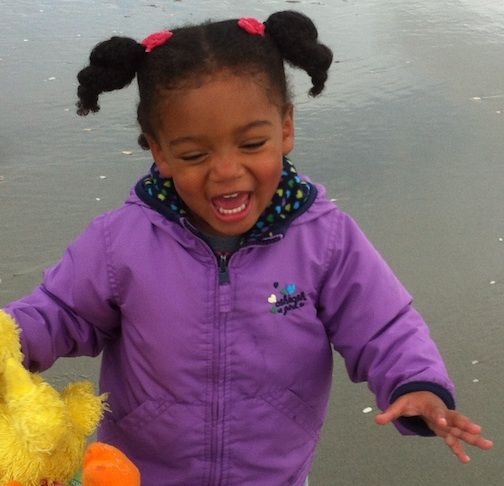 Ruby enjoyed taking her stuffed animal, a duck, with her to the beach at Thanksgiving.