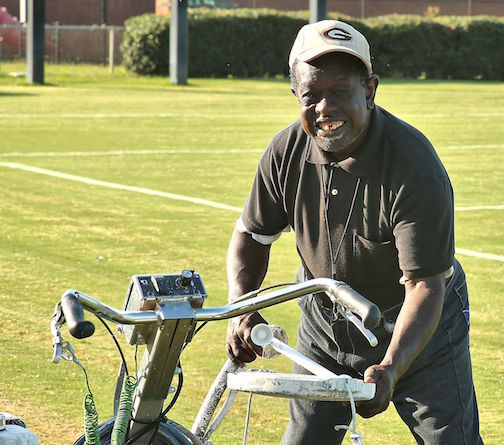 Gee has a mischievous look as he comes upon the machine that paints stripes at Dooley Field.
 
 