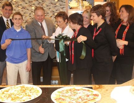 The ribbon cutting at Plate 108 on Poinsett Street marked the official opening of the cooking and entertainment venue.
