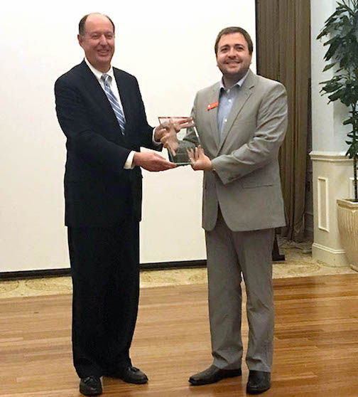 Chris Manely, Engenius CEO and Co-Founder (right) accepts the Small Business Champion of the Year award.
 
 