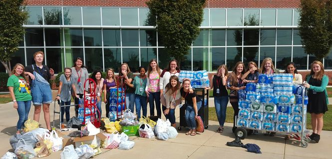 The Riverside swim team and cross country team helps flood victims.