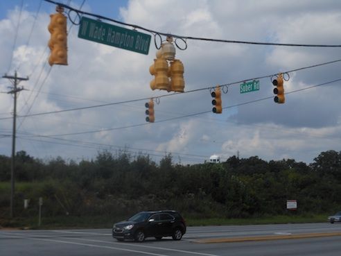 The intersection at Wade Hampton Boulevard and Suber Road is being marketed with IHOP being the tenant of the four unit development.