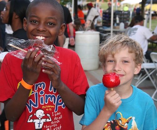 There's nothing like candy apples at a downtown festival. Jordan and Matthan are happy with theirs.
 