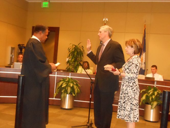 Mayor Rick Danner is sworn in for his fourth term as Mayor of Greer. Municipal Judge Henry Mims presides and Danner's wife, Rita, holds the Bible.