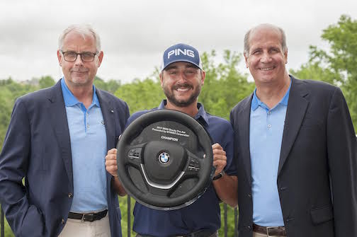 President and CEO, BMW Manufacturing Knudt Flor (left) and Bob Nitto (right) President, BMW Charity Pro-Am, congratulate winner Stephan Jaeger.
 
 