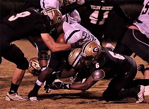 John Hicks tries to pry the ball loose on this play. The senior linebacker, leads Greer in individual and assisted tackles, tackles for loss, sacks and tied with recovered fumbles.