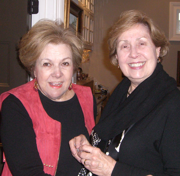 Margaret Burch, right, co founder of the GWG for Education, welcomes founding member Patricia Gibson.